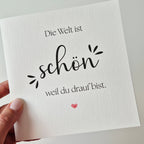 Grußkarte „Die Welt ist schön, weil du drauf bist"