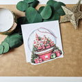 Weihnachtskarte mit Schneekugel-Motiv und Anhänger