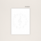 Notizblätter mit Musiknoten-Wasserzeichen