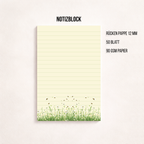 Schmaler, linierter Notizblock im Hochformat mit cremefarbenem Papier, feinen Linien und einer Blumenwiese mit kleinen Bienen am unteren Rand