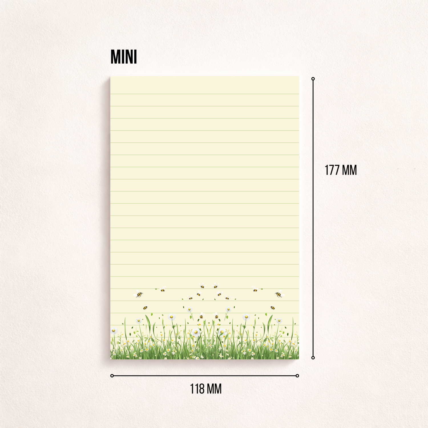 Schmaler, linierter Notizblock im Hochformat mit cremefarbenem Papier, feinen Linien und einer Blumenwiese mit kleinen Bienen am unteren Rand