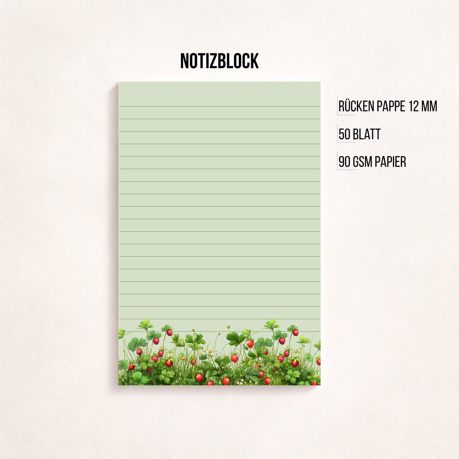 Liniertes Notizpapier im Hochformat mit grün-rosa Erdbeerwiesen-Motiv am unteren Rand, fotografiert auf dunkelgrauem Hintergrund. Links daneben liegt ein transparenter Stift parallel zum Block. Cleanes, minimalistisches Flatlay mit viel freiem Raum
