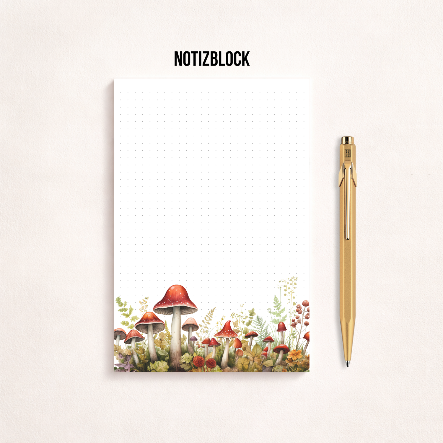 Weißes Notizblatt im Hochformat mit feinem Punktgitter und einer zarten Aquarell-Bordüre aus roten Pilzen, Blumen und Gräsern am unteren Rand